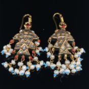 A PAIR OF TRADITIONAL INDIAN KUNDAN FISH FORM DROP EARRINGS. THE EARRINGS SET WITH WHITE MULTI FACET