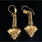 A PAIR OF TORPEDO SHAPED DROP EARRINGS, WITH A SCROLL AND FOLIATE DESIGN, ARTICULATING FROM HOOK AND