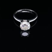 A DIAMOND SOLITAIRE RING. THE ROUND BRILLIANT CUT DIAMOND IN A FOUR CLAW RAISED SETTING. DIAMOND
