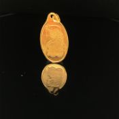 A SUISSE 10g FINE 24ct GOLD INGOT, FITTED WITH AN 18ct GOLD BAIL. LENGTH 3cms. WEIGHT 10.2grms