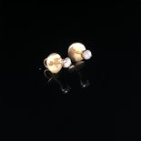 A PAIR OF ROUND BRILLIANT CUT DIAMOND STUDS IN FOUR CLAW SETTINGS WITH SCREW DOWN PIERCED EAR