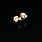 A PAIR OF ROUND BRILLIANT CUT DIAMOND STUDS IN FOUR CLAW SETTINGS WITH SCREW DOWN PIERCED EAR