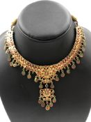 A DIAMOND AND GEMSET INDIAN TRADITIONAL KUNDAN SUITE COMPRISING OF A HEMISPHERICAL COLLAR WITH WOVEN