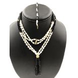 A CONTEMPORARY FRESHWATER PEARL AND BLACK HARD STONE TWO STRAND BEADED NECKLACE AND MATCHING