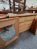 A WOVEN CANE MIRROR BACKED DRESSING CHEST OF FOUR DRAWERS.