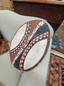 A MAASAI PAINTED LEATHER SHIELD