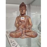 A GILT WOOD FIGURE OF THE BUDDHA HIS RIGHT HAND RAISED AN A WELCOME GESTURE