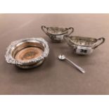 A SMALL HALLMARKED SILVER WINE COASTER WITH MAHOGANY BASE, AND TWO SILVER TWO HANDLED SALTS. GROSS