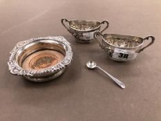 A SMALL HALLMARKED SILVER WINE COASTER WITH MAHOGANY BASE, AND TWO SILVER TWO HANDLED SALTS. GROSS