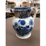 A VICTORIAN BLUE AND WHITE PUZZLE JUG.
