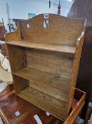 AN ARTS AND CRAFTS OAK SET OF WALL SHELVES WITH ENCLOSED BACK