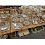 A LARGE QUANTITY OF ELECTROPLATE, TO INCLUDE: CANDELABRA, CANDLE STICKS, VEGETABLE TUREENS, WINE