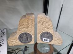 A PAIR OF BOOKENDS CUT FROM STONE FROM THE HOUSES OF PARLIAMENT