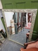 A LARGE SILVER FRAME BEVEL EDGE WALL MIRROR.