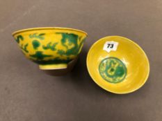 A PAIR OF CHINESE YELLOW GROUND BOWLS DECORATED WITH GREEN FIVE TOED DRAGONS EACH WITH INCISED SIX
