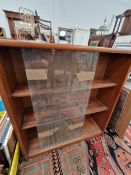 A 20th C. JONELLE MAHOGANY BOOK CASE WITH SLIDING GLASS DOORS OVER SHELVES. W 76 x D 18 x h 84cms.