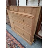 AN UN-UNSUAL WALNUT CHEST OF 5 DRAWERS.
