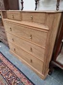 AN UN-UNSUAL WALNUT CHEST OF 5 DRAWERS.