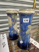 A PAIR OF DOULTON STONEWARE VASES DECORATED WITH WHITE ROSES