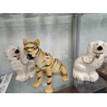 A BONDIA POTTERY SEATED TIGER TOGETHER WITH A PAIR OF STAFFORDSHIRE SPANIELS