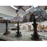 THREE TIFFANY STYLE TABLE LAMPS WITH LEADED GLASS SHADES
