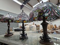 THREE TIFFANY STYLE TABLE LAMPS WITH LEADED GLASS SHADES