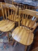 A SET OF FOUR PINE KITCHEN CHAIRS