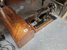 A SINGER ELECTRIC SEWING MACHINE
