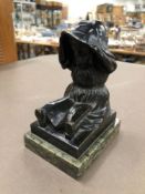 AN EARLY 20th C. BRONZE FIGURE OF A GIRL READING ON A GREEN MARBLE BASE.