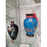A JAPANESE WIRELESS CLOISONNE BLUE GROUND VASE DECORATED WITH GEESE TOGETHER WITH A CLOISONNE VASE