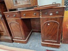 A SMALL VICTORIAN MAHOGANY KNEEHOLE DRESSING TABLE STAMPED NUTTALL & SONS