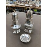 TWO HALLMARKED SILVER SUGAR CASTERS AND A PIN DISH WITH COIN CENTRE. GROSS WEIGHT 428grms.
