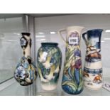 TWO MOORCROFT EWERS AND TWO VASES OF VARIOUS PATTERNS