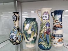 TWO MOORCROFT EWERS AND TWO VASES OF VARIOUS PATTERNS