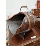 A BARREL FORM COAL SCUTTLE.