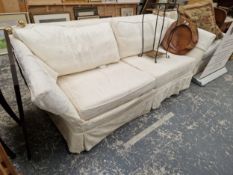 A KNOLE SETTEE AND AN ARMCHAIR UPHOLSTERED IN MATCHING CREAM DAMASK