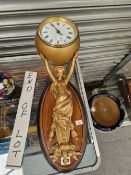 A JAPY FRERES TIMEPIECE HELD UP BY A GILT SPELTER CARYATID MOUNTED ON AN OVAL WOOD WALL BRACKET