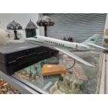 A SCALE MODEL FALCON 2000 JET AEROPLANE WITH A STAND AND PACKING CASE
