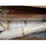 A QUANTITY OF UPHOLSTERY FABRICS ON ROLLS.