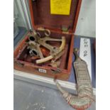 A BOXED SEXTANT TOGETHER WITH AN ARABIAN DAGGER WITH A HORN HANDLE AND IN A METAL MOUNTED SHEATH