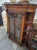 A VICTORIAN MAHOGANY AND INLAID GLAZED SMALL BOOKCASE WITH BOW SHELVED SIDES