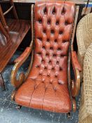 A BUTTON LEATHER UPHOLSTERED ROCKING CHAIR.