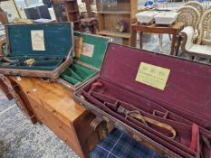 TWO WESTLEY RICHARDS LEATHER MOUNTED CASES FOR PAIRS OF SHOTGUNS AND ANOTHER LABELLED FOR STEPHEN
