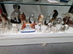 A COLLECTION OF CERAMIC DOGS