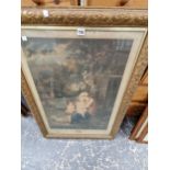 A FRAMED PRINT OF A MOTHER AND TWO CHILDREN IN A LANDSCAPE