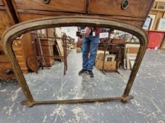 A 19th C ROUND ARCHED MIRROR IN AN OVER PAINTED GILT FRAME. 118 x 85cms.