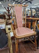 A LATE 19th/EARLY 20th C. ELBOW CHAIR, THE CENTRE OF THE BACK AND THE SEAT UPHOLSTERED