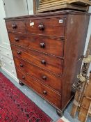 A LARGE MID VICTORIAN MAHOGANY CHEST OF 2S AND 3 LONG DRAWERS WITH BUN HANDLES