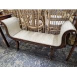 A 19th C. MAHOGANY WINDOW SEAT WITH FLUTED LEGS SPLAYING TO BRASS CASTER FEET.