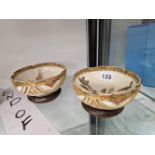 A PAIR OF 20th C. SATSUMA BOWLS ON WOOD STANDS